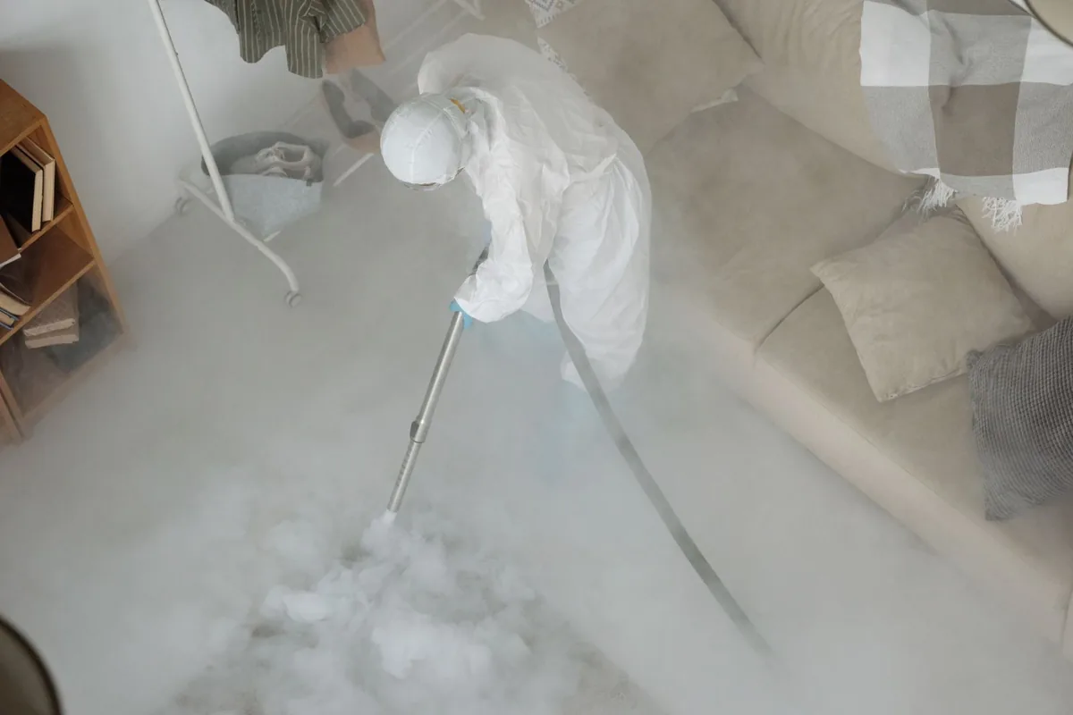 Biohazard cleanup technician in protective equipment, Miles City, MT